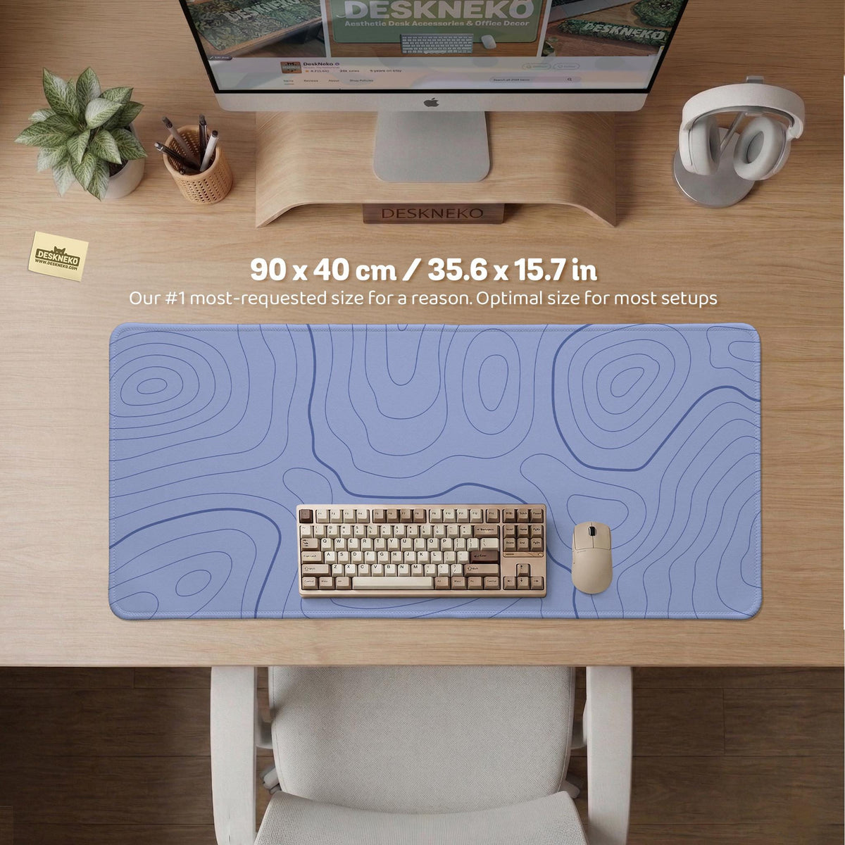 A pastel blue mousepad with an abstract topographic contour line pattern.