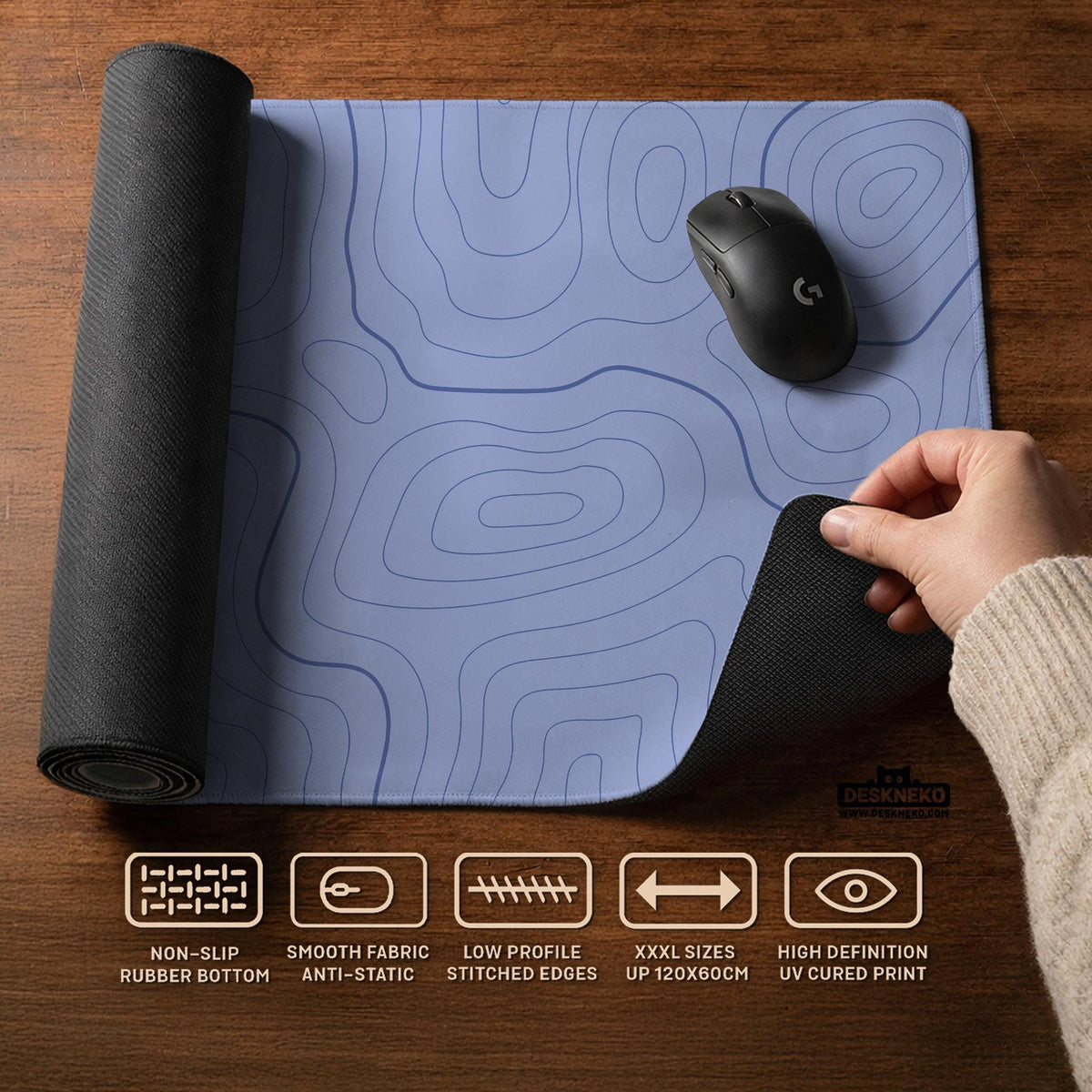 A pastel blue mousepad with an abstract topographic contour line pattern.