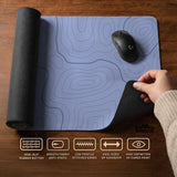 A pastel blue mousepad with an abstract topographic contour line pattern.