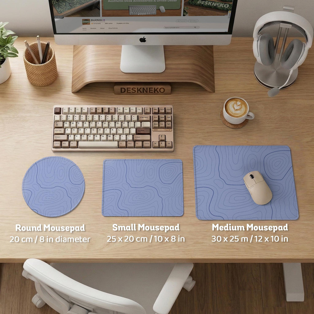 A pastel blue mousepad with an abstract topographic contour line pattern.