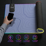 A pastel blue mousepad with an abstract topographic contour line pattern.
