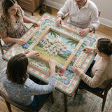 Pastel mahjong mat with a pink gingham border, seashells, hydrangea pots, palm trees, croquet details, and a coastal garden scene.