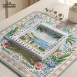 Pastel mahjong mat with a pink gingham border, seashells, hydrangea pots, palm trees, croquet details, and a coastal garden scene.