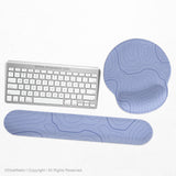 Periwinkle ergonomic mousepad and keyboard wrist rest with a light blue topographic contour line pattern.