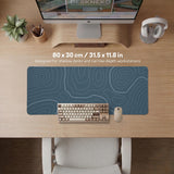 Blue mousepad with a topographic line pattern on a slate background.