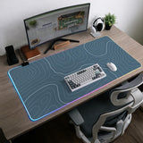 Blue mousepad with a topographic line pattern on a slate background.