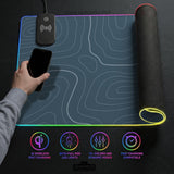 Blue mousepad with a topographic line pattern on a slate background.
