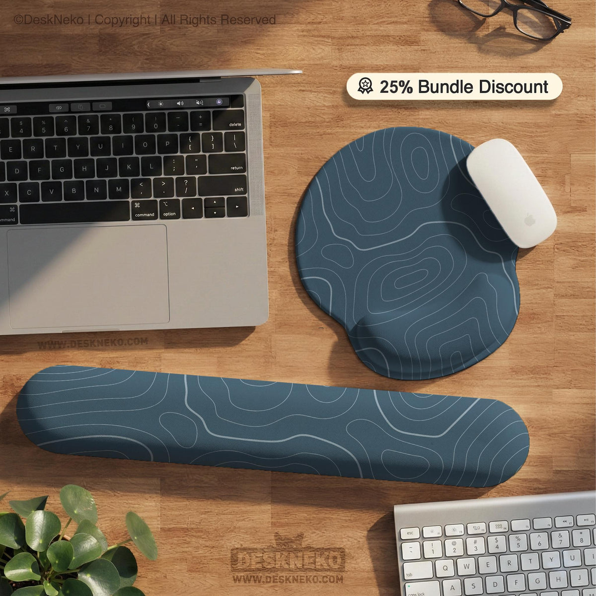 A slate blue desk mat with thin contour line map art on a light background.