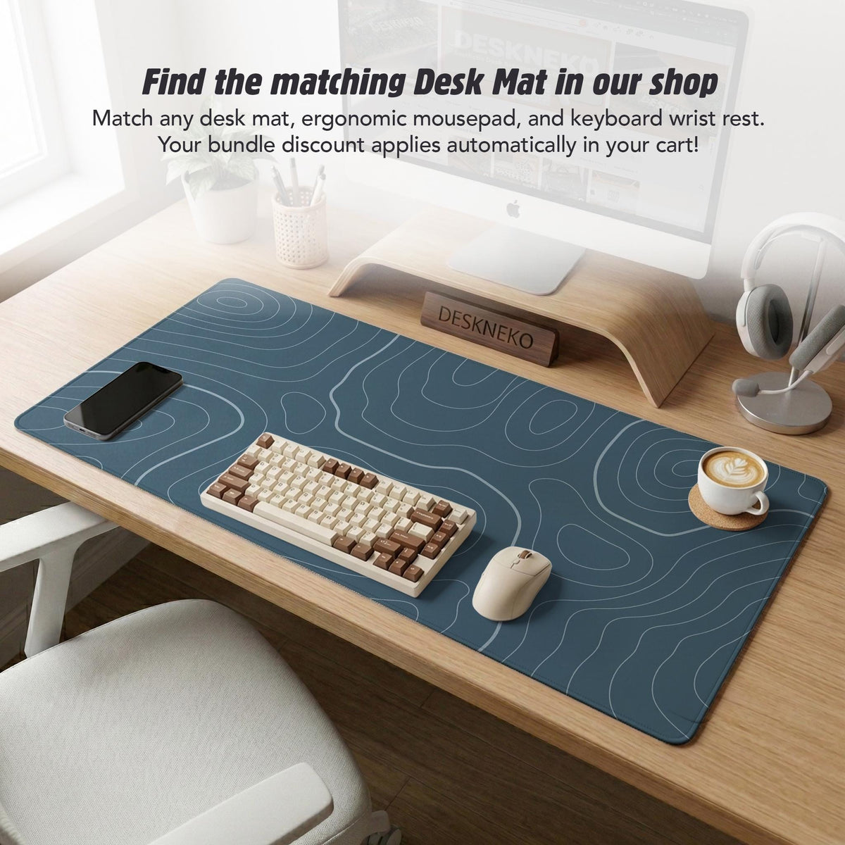 Muted blue desk mat with thin topographic line art pattern shown with matching mousepad and keyboard wrist rest options.
