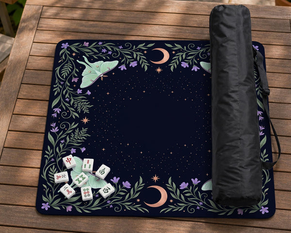 Navy square mahjong mat with a floral border, copper moons, scattered stars, pale moths, and leafy botanical details.