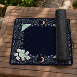 Navy square mahjong mat with a floral border, copper moons, scattered stars, pale moths, and leafy botanical details.