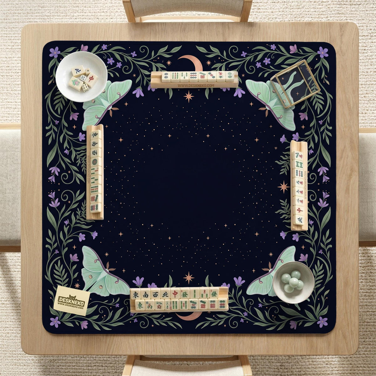 Navy square mahjong mat with a floral border, copper moons, scattered stars, pale moths, and leafy botanical details.