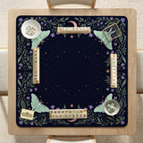 Navy square mahjong mat with a floral border, copper moons, scattered stars, pale moths, and leafy botanical details.