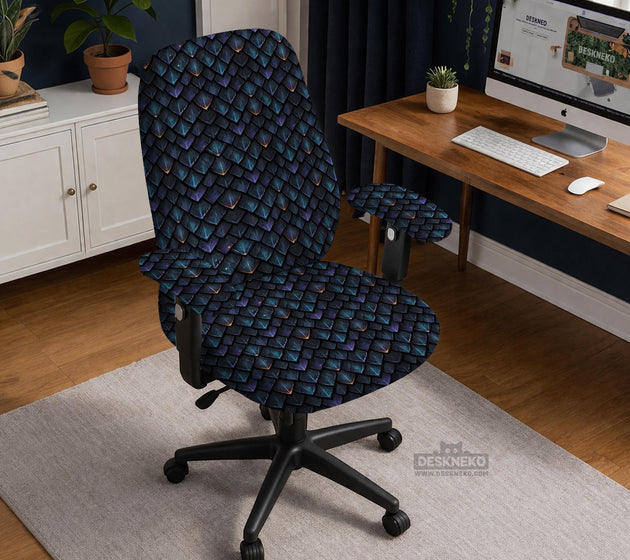 An indigo desk chair cover with a dragon scale pattern in blue, navy, purple, and copper tones, shown as a stretch slipcover with coverage options.