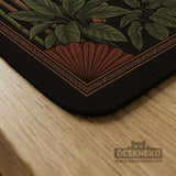 Black square mahjong mat with mirrored tiger faces, bamboo, dark tropical leaves, ornate border details, and orange accents.