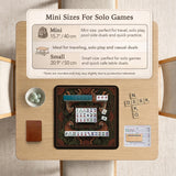 Black square mahjong mat with mirrored tiger faces, bamboo, dark tropical leaves, ornate border details, and orange accents.