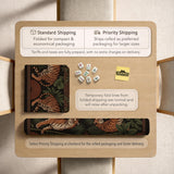 Black square mahjong mat with mirrored tiger faces, bamboo, dark tropical leaves, ornate border details, and orange accents.