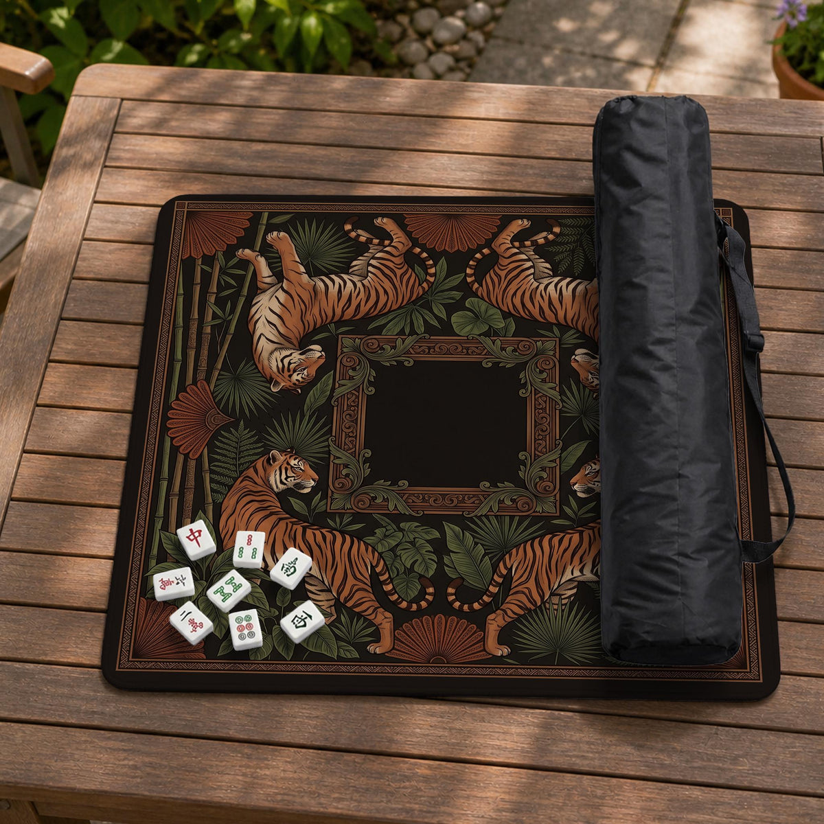 Black square mahjong mat with mirrored tiger faces, bamboo, dark tropical leaves, ornate border details, and orange accents.