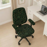 Forest green chair cover with a tropical leaf pattern featuring monstera leaves and small cream flowers.