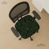 Forest green chair cover with a tropical leaf pattern featuring monstera leaves and small cream flowers.