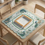Teal square mahjong mat with peacock feathers, soft floral pattern, tassel details, and printed rule guide text in the center.