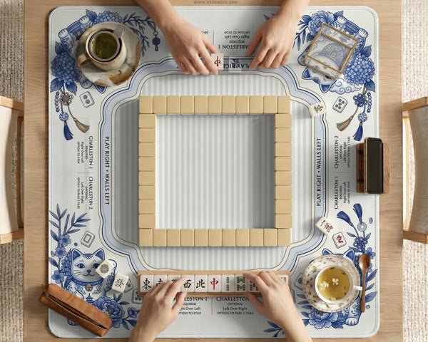 Blue and white square mahjong mat with lucky cat artwork, floral chinoiserie pattern, tile icons, and a rule guide layout.