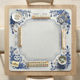 Blue and white square mahjong mat with lucky cat artwork, floral chinoiserie pattern, tile icons, and a rule guide layout.