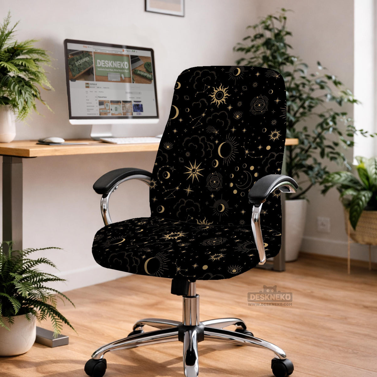 Black chair cover with gold moons, suns, stars, constellations, and line art printed across the fabric.