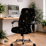 Black chair cover with gold moons, suns, stars, constellations, and line art printed across the fabric.