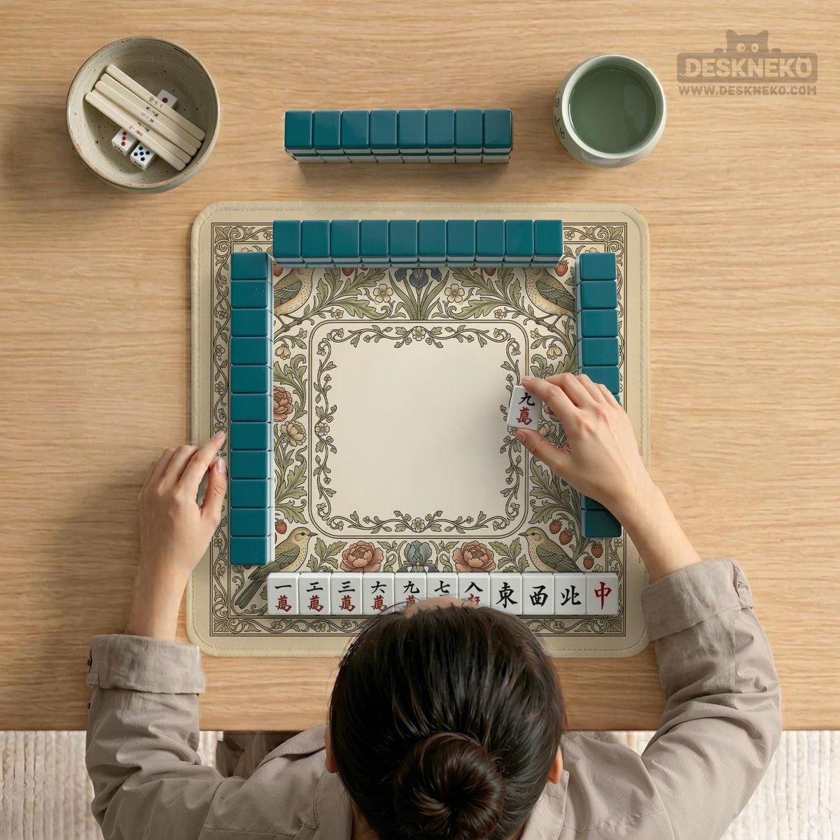 Square mahjong table mat with vintage bird artwork, floral border detail, and sage green, cream, muted blue, and terracotta tones.
