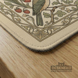 Square mahjong table mat with vintage bird artwork, floral border detail, and sage green, cream, muted blue, and terracotta tones.