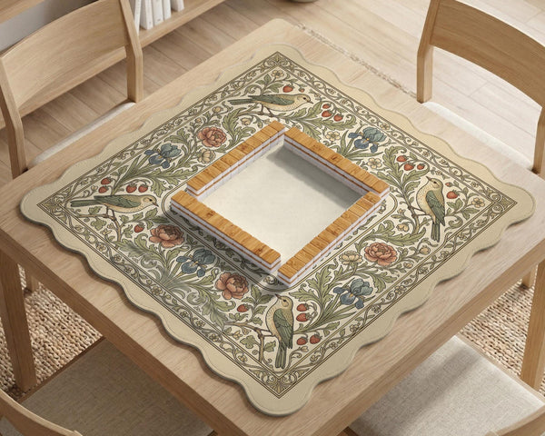 Square mahjong table mat with vintage bird artwork, floral border detail, and sage green, cream, muted blue, and terracotta tones.