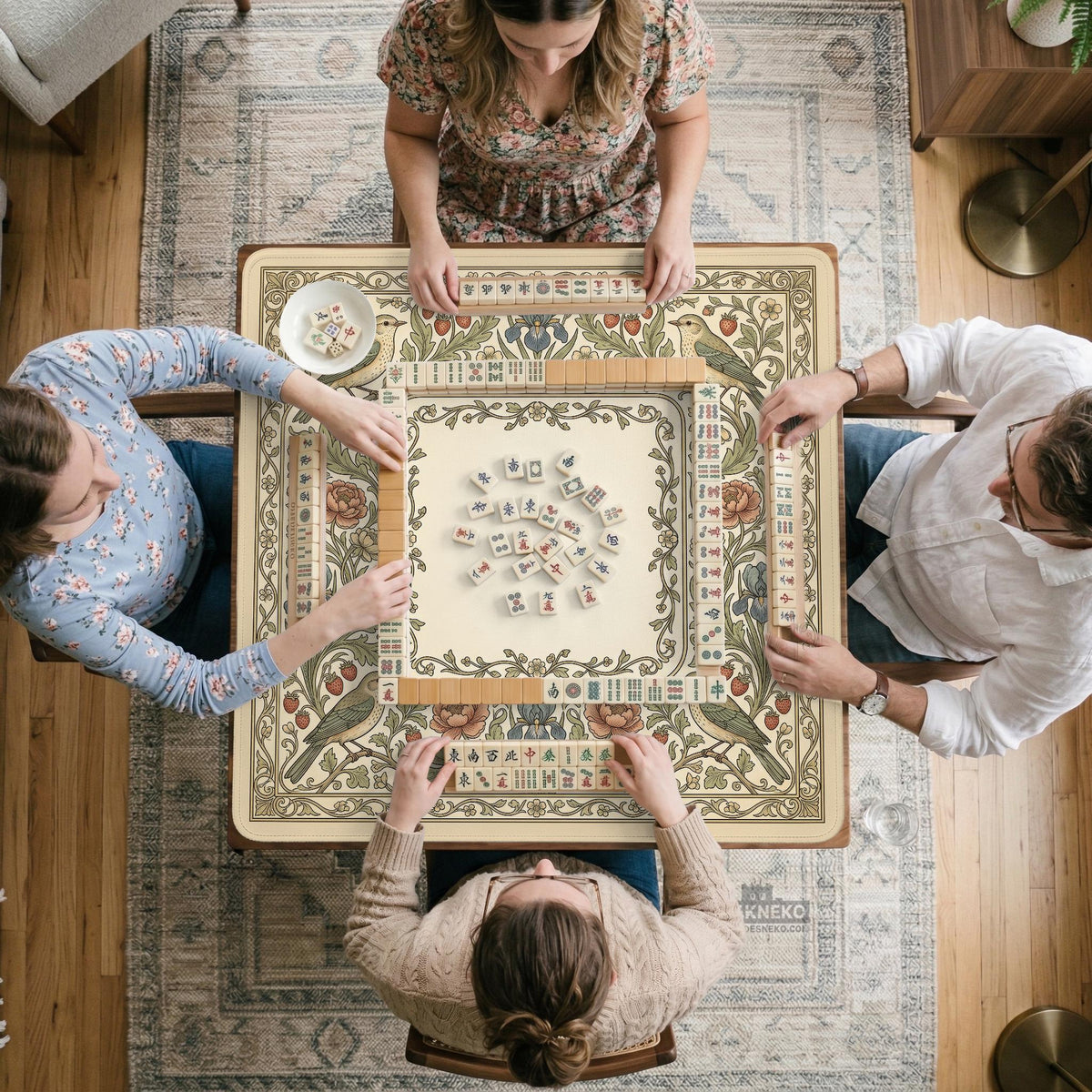 Square mahjong table mat with vintage bird artwork, floral border detail, and sage green, cream, muted blue, and terracotta tones.