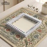 Square mahjong table mat with vintage bird artwork, floral border detail, and sage green, cream, muted blue, and terracotta tones.