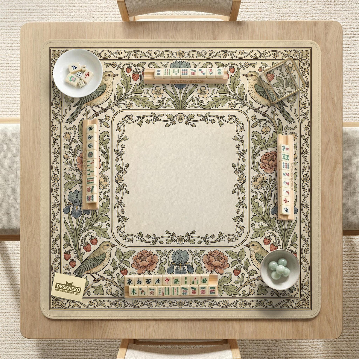 Square mahjong table mat with vintage bird artwork, floral border detail, and sage green, cream, muted blue, and terracotta tones.