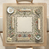 Square mahjong table mat with vintage bird artwork, floral border detail, and sage green, cream, muted blue, and terracotta tones.