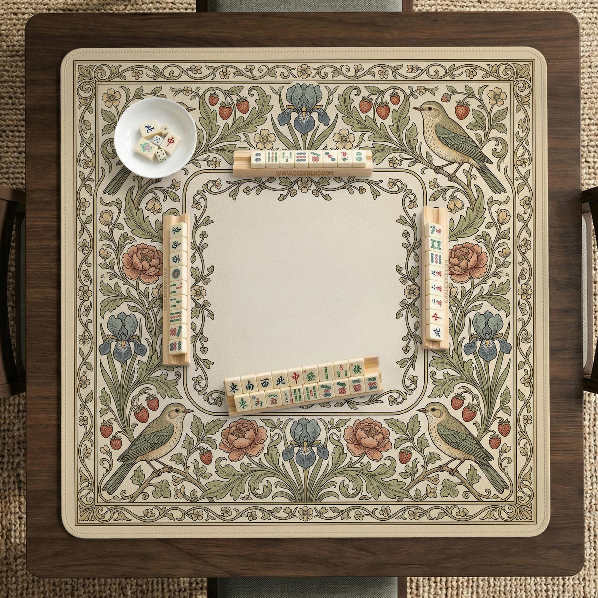 Square mahjong table mat with vintage bird artwork, floral border detail, and sage green, cream, muted blue, and terracotta tones.