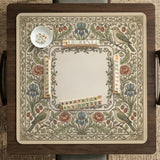 Square mahjong table mat with vintage bird artwork, floral border detail, and sage green, cream, muted blue, and terracotta tones.