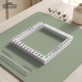 A plain light sage green square mahjong mat with a smooth solid-color surface.
