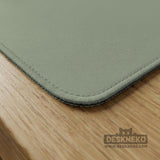 A plain light sage green square mahjong mat with a smooth solid-color surface.