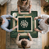Square emerald green mahjong mat with bamboo line art, gold geometric cloud shapes, and a plain center playing area.