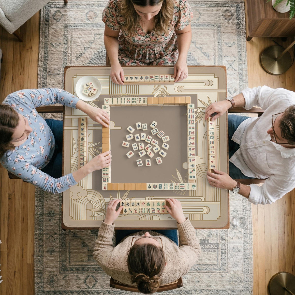 Beige and gold square mahjong mat with a bamboo pattern and geometric border.