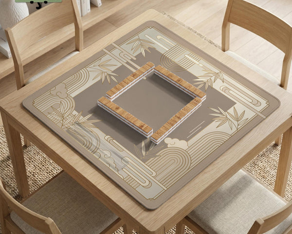 Beige and gold square mahjong mat with a bamboo pattern and geometric border.