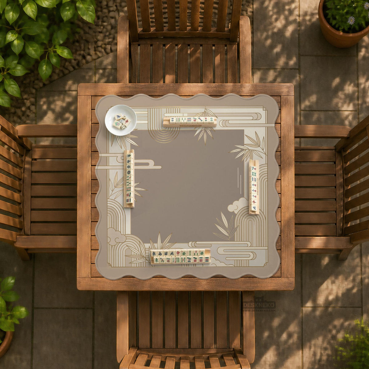 Beige and gold square mahjong mat with a bamboo pattern and geometric border.