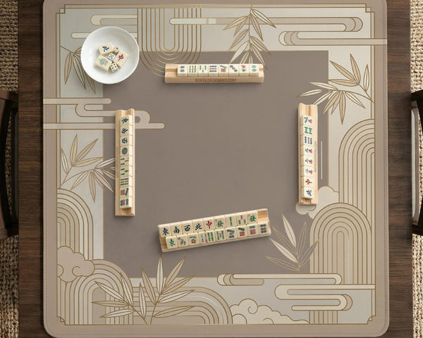 Beige and gold square mahjong mat with a bamboo pattern and geometric border.