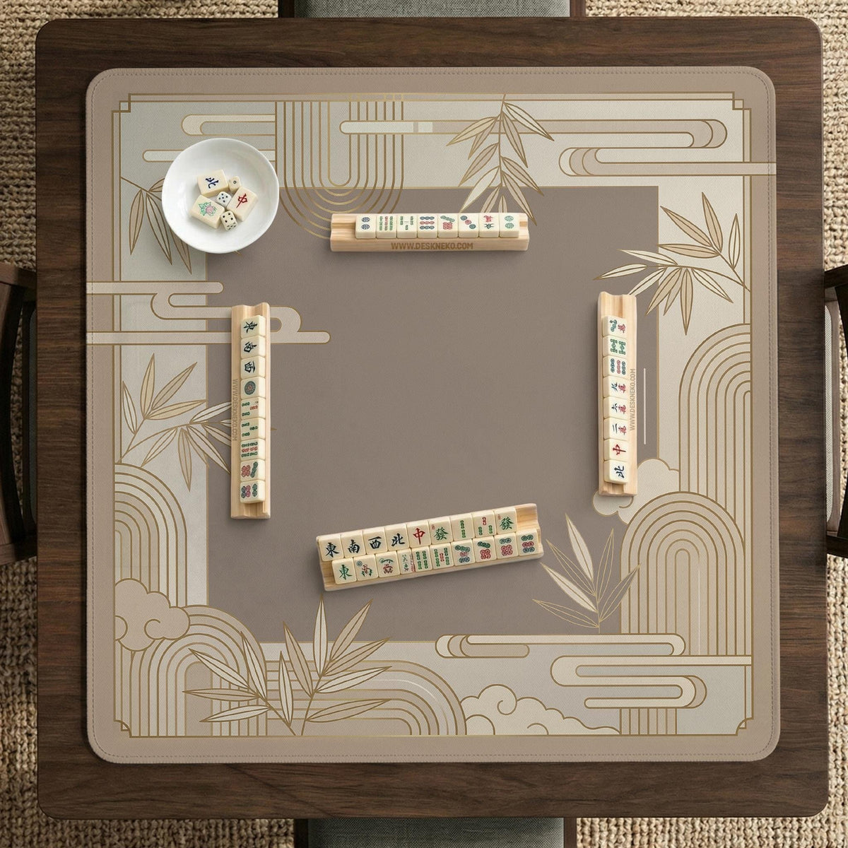 Beige and gold square mahjong mat with a bamboo pattern and geometric border.