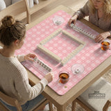 Pink checkered mahjong mat with small hearts and flowers.