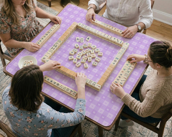 Lavender gingham mahjong mat with a scalloped edge and a pastel check pattern.