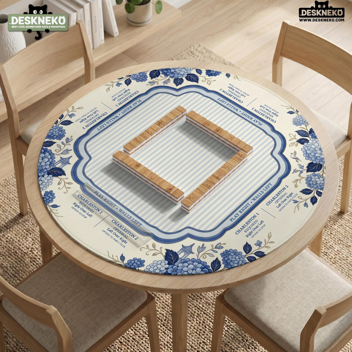 Blue and white mahjong table mat with a floral border, small birds, pagoda details, striped center, and printed rules around the edge.