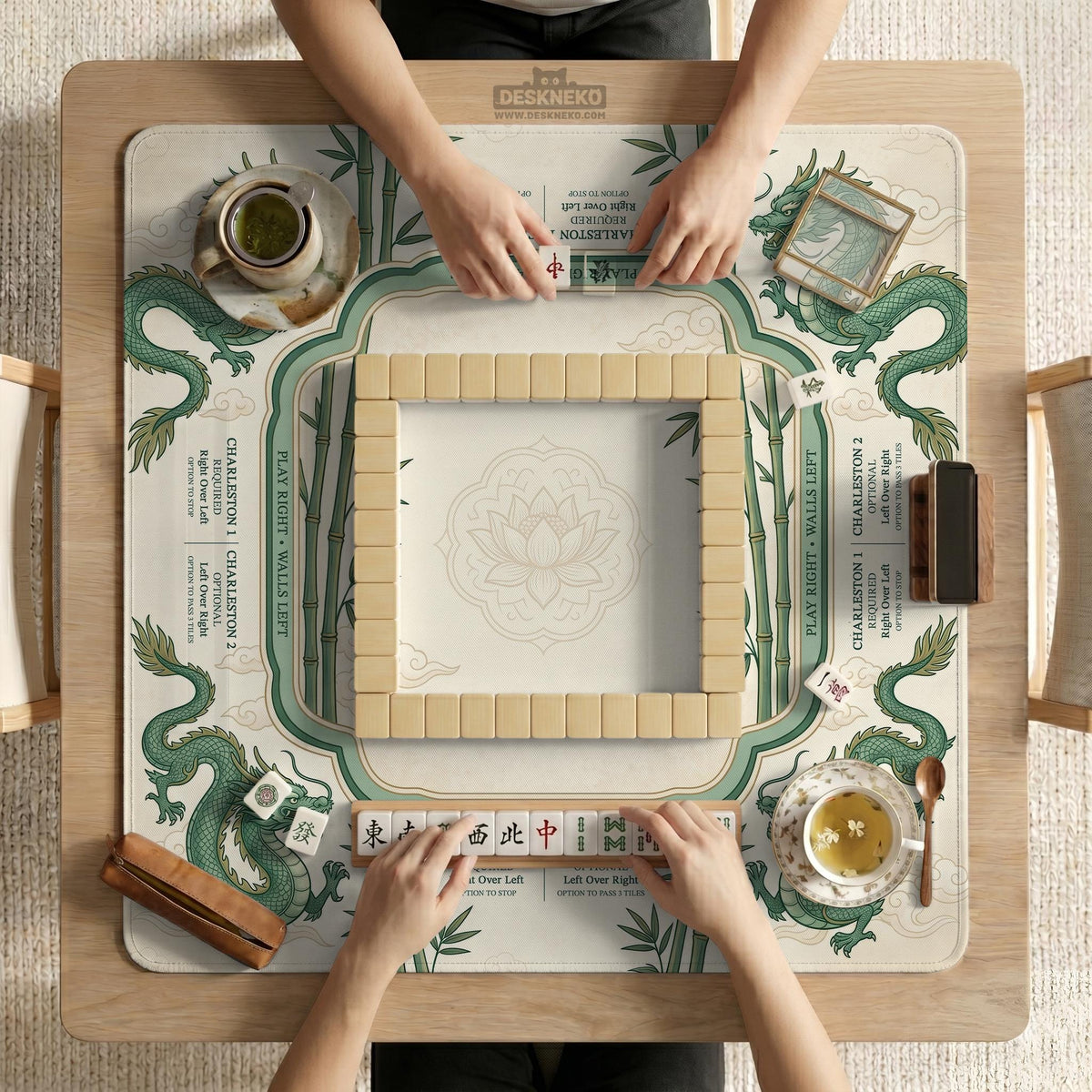 Sage green mahjong mat with a bamboo pattern, dragon design, printed rules around the edge, and a scalloped edge option.